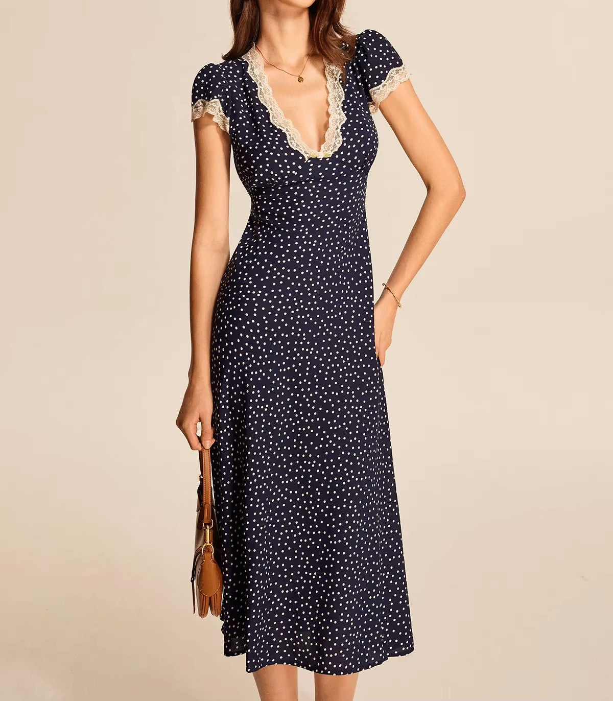 Polka dot dress with lace neckline
