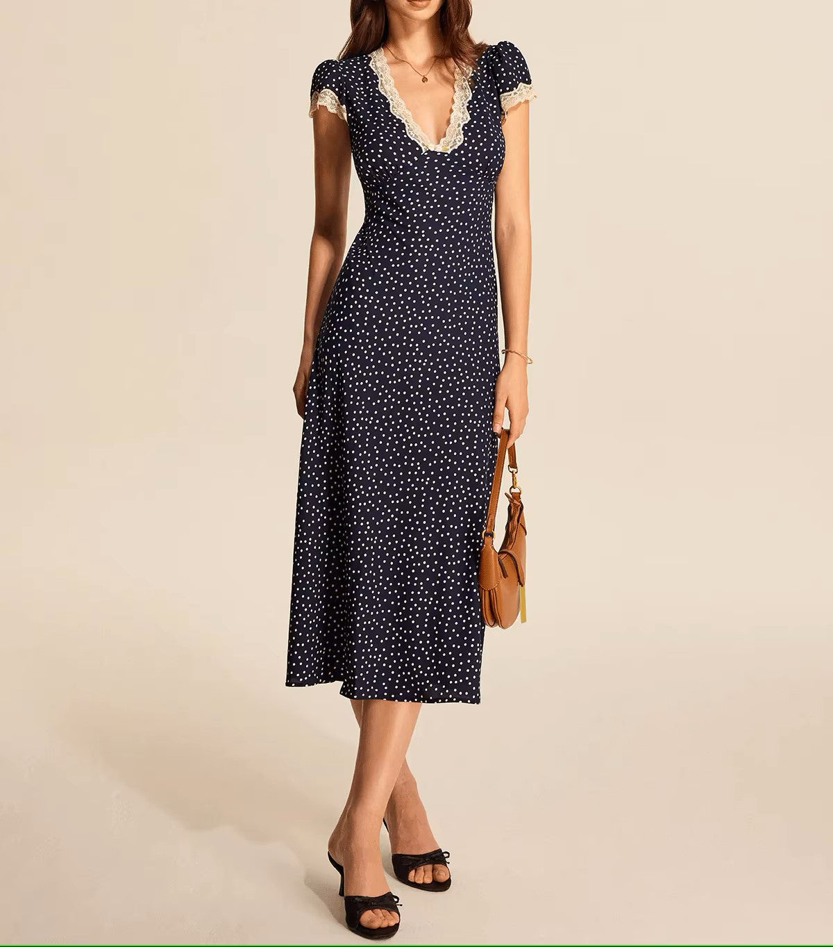 Polka dot dress with lace neckline